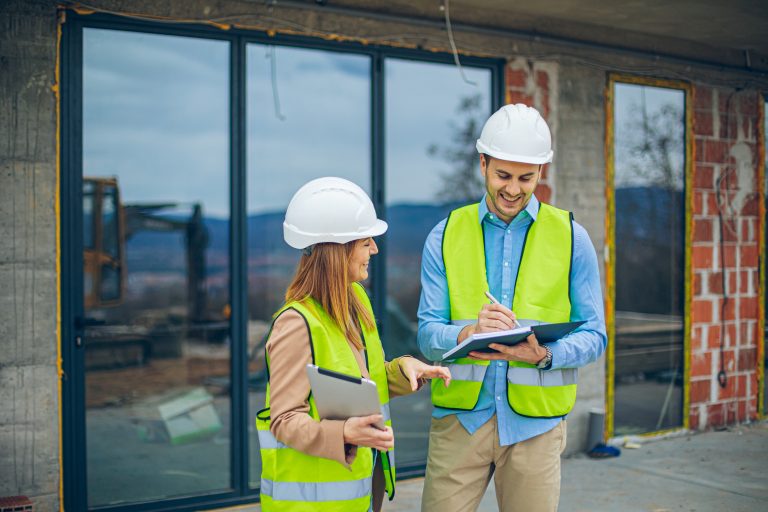 Architects discussing plan at construction